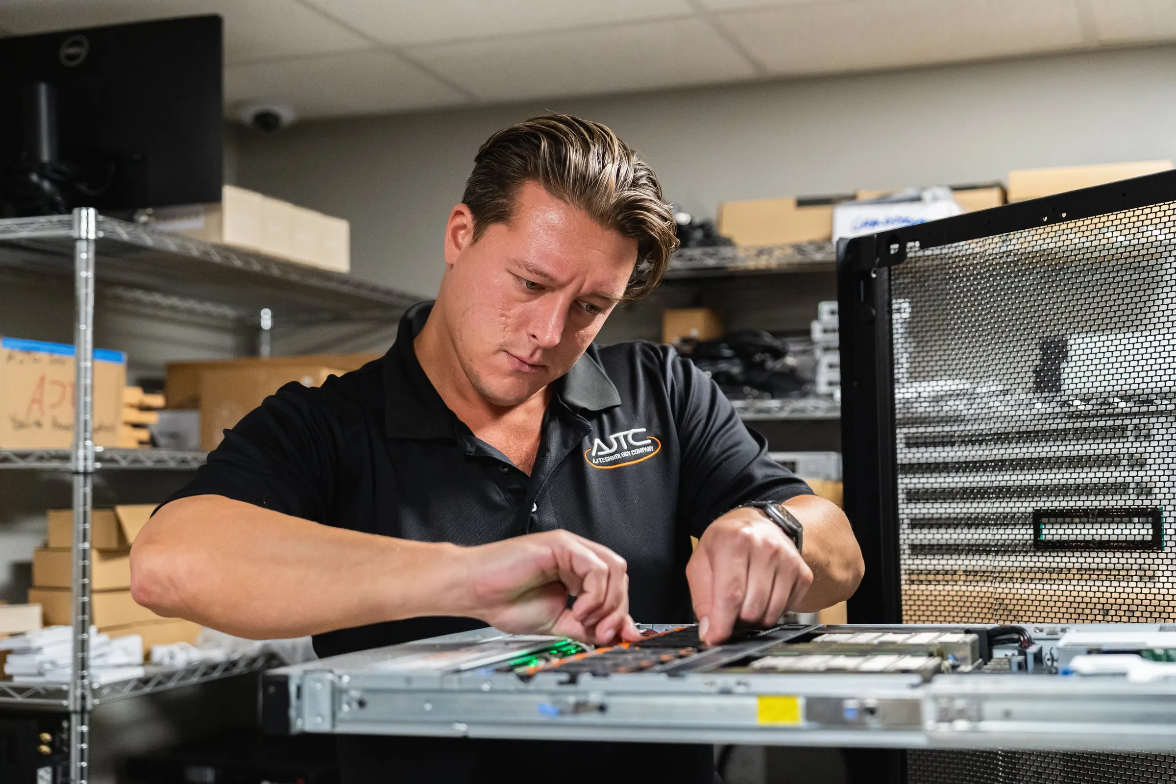 AJTC engineer servicing a server